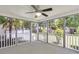 Relaxing screened porch with ceiling fan and views of the backyard and mature trees at 9253 N Moreto Cir, Summerville, SC 29485