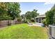 Spacious backyard features lush lawn, landscaping, and a screened in porch at 9616 Pebble Creek Blvd, Summerville, SC 29485