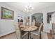 Breakfast nook featuring decorative chandelier with views into adjacent rooms at 9616 Pebble Creek Blvd, Summerville, SC 29485