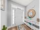 Inviting entryway with white trim, and a decorative mirror, creating a warm and welcoming atmosphere at 9616 Pebble Creek Blvd, Summerville, SC 29485