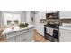 Bright kitchen featuring white cabinets, stainless steel appliances, and an island at 9616 Pebble Creek Blvd, Summerville, SC 29485