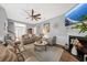 Inviting living room with a fireplace, plush seating, and stylish decor creating a comfortable and elegant space at 9616 Pebble Creek Blvd, Summerville, SC 29485
