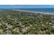 Aerial view of the community with a red arrow indicating the property's location near the beach at 10 Chapman Ave, Isle of Palms, SC 29451