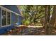 Side view of the home showing the yard, with mature landscaping providing a private and serene outdoor space at 10 Chapman Ave, Isle of Palms, SC 29451