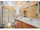 Bright bathroom featuring a double vanity, glass shower and a barn door at 10 Chapman Ave, Isle of Palms, SC 29451