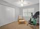 Bedroom with carpet, a ceiling fan, a closet, a chair and an inversion table at 10 Chapman Ave, Isle of Palms, SC 29451