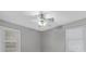 Neutral bedroom featuring a ceiling fan, light gray paint and two windows at 10 Chapman Ave, Isle of Palms, SC 29451