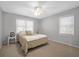 Comfortable bedroom with soft carpet, neutral tones, and ample natural light from large windows at 10 Chapman Ave, Isle of Palms, SC 29451