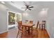 Cozy dining room with a wooden table and a sliding glass door to the yard at 10 Chapman Ave, Isle of Palms, SC 29451