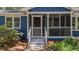 Inviting front porch with a screen door and painted steps at 10 Chapman Ave, Isle of Palms, SC 29451