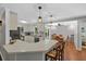 Bright kitchen with a breakfast bar and an open dining area at 10 Chapman Ave, Isle of Palms, SC 29451