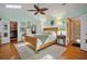 Inviting main bedroom with natural light, hardwood floors, en-suite and walk-in closet at 10 Chapman Ave, Isle of Palms, SC 29451