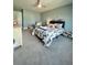 Charming bedroom with patterned bedding, blue accent wall, and plentiful space, creating a cozy, personalized atmosphere at 103 Granton Edge Ln, Summerville, SC 29486