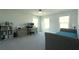 This bedroom features an attached study area with large windows, providing natural light and a view at 103 Granton Edge Ln, Summerville, SC 29486