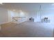 Spacious bonus room featuring neutral carpet, white walls, and ample natural light, perfect for flexible living and recreation at 103 Granton Edge Ln, Summerville, SC 29486
