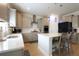 Stylish kitchen featuring white countertops, stainless steel appliances, and a central island with bar stools at 103 Granton Edge Ln, Summerville, SC 29486