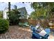 Charming brick patio featuring outdoor seating amidst lush landscaping at 1067 Loyalist Ln, Mount Pleasant, SC 29464
