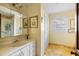 Well-lit bathroom with marble-look flooring, large vanity, and a glass-enclosed shower at 1067 Loyalist Ln, Mount Pleasant, SC 29464
