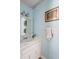 Traditional bathroom with vanity, ornate lighting, and soft blue painted walls at 1067 Loyalist Ln, Mount Pleasant, SC 29464
