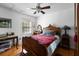 Cozy bedroom featuring a wood-framed bed, stylish desk, and natural light at 1067 Loyalist Ln, Mount Pleasant, SC 29464