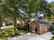 Charming two-story brick home with a well-manicured lawn and mature trees at 1067 Loyalist Ln, Mount Pleasant, SC 29464