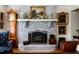 Classic brick fireplace with decorative mantel and vintage accents at 1067 Loyalist Ln, Mount Pleasant, SC 29464