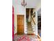 Inviting foyer with hardwood floors, staircase, and elegant chandelier at 1067 Loyalist Ln, Mount Pleasant, SC 29464