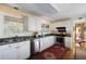 Traditional kitchen featuring white cabinets, stainless steel appliances, and a vibrant oriental rug at 1067 Loyalist Ln, Mount Pleasant, SC 29464