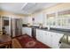 Bright kitchen featuring stainless steel appliances and a vibrant oriental rug under white cabinets at 1067 Loyalist Ln, Mount Pleasant, SC 29464