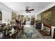 Detailed view of an office with abundant natural light, art, and hardwood floors at 1067 Loyalist Ln, Mount Pleasant, SC 29464