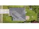 Aerial view of house with a dark roof, green grass and a stone patio at 112 Worthington Dr, Moncks Corner, SC 29461