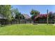 Lush, green fenced-in backyard features a charming garden and blooming flowers at 112 Worthington Dr, Moncks Corner, SC 29461