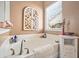 Close up on tub featuring a neutral design, organized amenities, and a bright window at 112 Worthington Dr, Moncks Corner, SC 29461