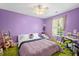 Cozy purple bedroom featuring desk space, lots of light, and a ceiling fan at 112 Worthington Dr, Moncks Corner, SC 29461