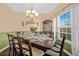Formal dining room showcases a beautifully set table and ample natural light at 112 Worthington Dr, Moncks Corner, SC 29461