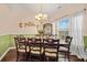 Formal dining room showcases a beautifully set table, stylish decor, and ample natural light at 112 Worthington Dr, Moncks Corner, SC 29461