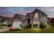 Charming two-story home features a well-maintained lawn, inviting entrance, and attached garage at 112 Worthington Dr, Moncks Corner, SC 29461