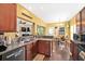 Open floor plan showcasing kitchen with bar seating overlooking the living room and dining area at 112 Worthington Dr, Moncks Corner, SC 29461
