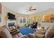 Cozy living room features a fireplace, ceiling fan, and comfortable seating arrangement at 112 Worthington Dr, Moncks Corner, SC 29461