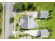Aerial view of home with long driveway, detached garage, and surrounded by lush greenery at 123 Gaslight Blvd, Summerville, SC 29483