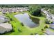 Lush landscaped residential area showcasing a serene pond surrounded by well-maintained homes and greenery at 123 Gaslight Blvd, Summerville, SC 29483