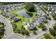 Home in a well-planned community with a scenic pond, lush landscaping, and manicured lawns at 123 Gaslight Blvd, Summerville, SC 29483