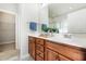 Bathroom vanity featuring wood cabinetry, modern fixtures, and generous counter space at 123 Gaslight Blvd, Summerville, SC 29483