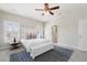 Neutral bedroom with white furniture, bench at the end of the bed, and shuttered windows at 123 Gaslight Blvd, Summerville, SC 29483