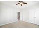 Neutral bedroom features a ceiling fan and a walk-in closet, complemented by carpet flooring at 123 Gaslight Blvd, Summerville, SC 29483