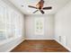 Clean, well-lit bedroom with hardwood floors, plantation shutters, and a ceiling fan at 123 Gaslight Blvd, Summerville, SC 29483