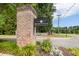 Welcoming entrance sign for the Reminisce community, set against a backdrop of lush greenery at 123 Gaslight Blvd, Summerville, SC 29483