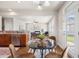 Charming breakfast nook with a glass-top table, hardwood floors, and views of the backyard at 123 Gaslight Blvd, Summerville, SC 29483