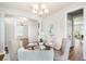 Cozy dining room featuring plantation shutters and a modern chandelier at 123 Gaslight Blvd, Summerville, SC 29483