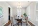 Cozy dining room featuring plantation shutters and a modern chandelier at 123 Gaslight Blvd, Summerville, SC 29483